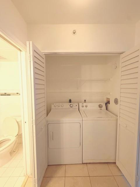 2011 Renaissance Boulevard, Unit 103 Miramar, FL 33025 - Photo 14 of 25 a utility room with dryer and washer