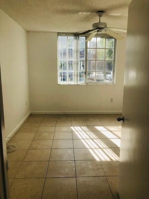 2011 Renaissance Boulevard, Unit 103 Miramar, FL 33025 - Photo 16 of 25 a view of an empty room with a window