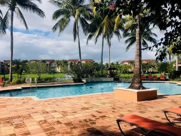 a view of a livingroom with furniture and a large window
