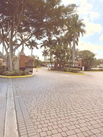 a spacious bathroom with a granite countertop sink mirror and a shower