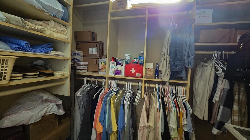 927 Yew Street Sebastian, FL 32976 - Photo 20 of 49 a view of walk in closet with clothes and shoes