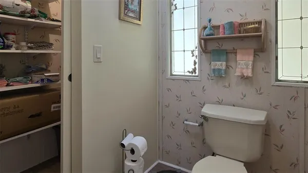 a bathroom with a toilet and a sink