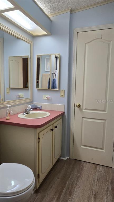 927 Yew Street Sebastian, FL 32976 - Photo 30 of 49 a bathroom with a sink a toilet and mirror