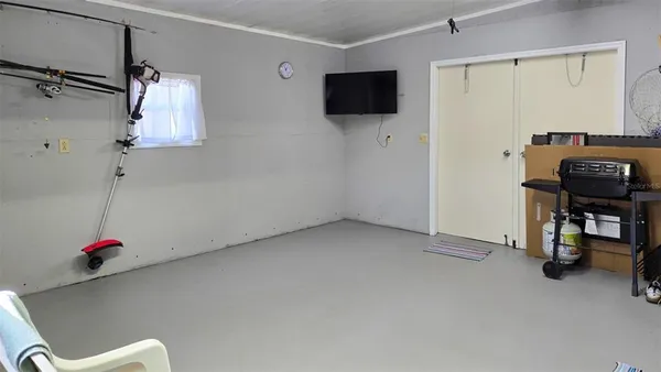 a view of a livingroom with furniture and a flat screen tv