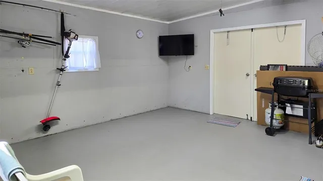 a view of a livingroom with furniture and a flat screen tv