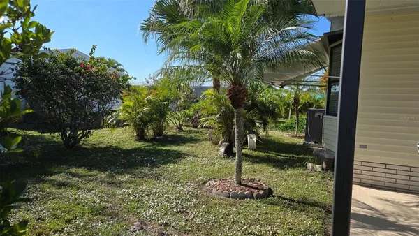 a backyard of a house with lots of green space