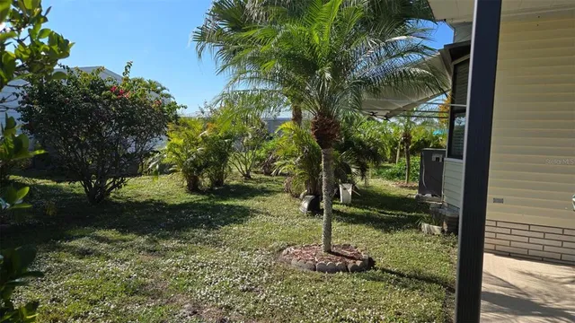 a backyard of a house with lots of green space