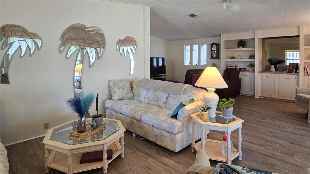 927 Yew Street Sebastian, FL 32976 - Photo 5 of 49 a living room with furniture and wooden floor