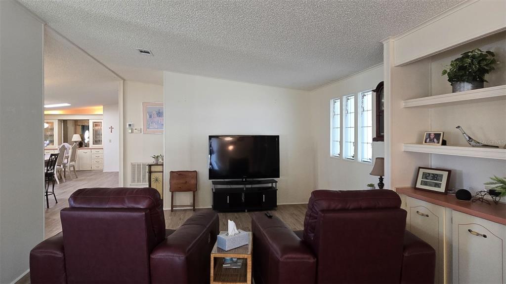 927 Yew Street Sebastian, FL 32976 - Photo 9 of 49 a living room with furniture and a flat screen tv