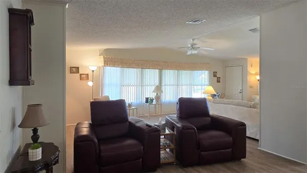 a living room with furniture and a window