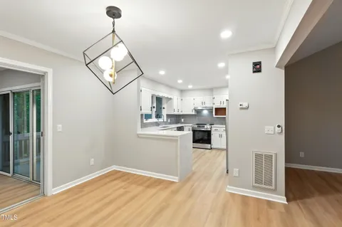 a view of a kitchen with microwave and cabinets