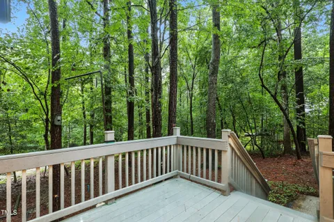 a balcony with trees in front of it