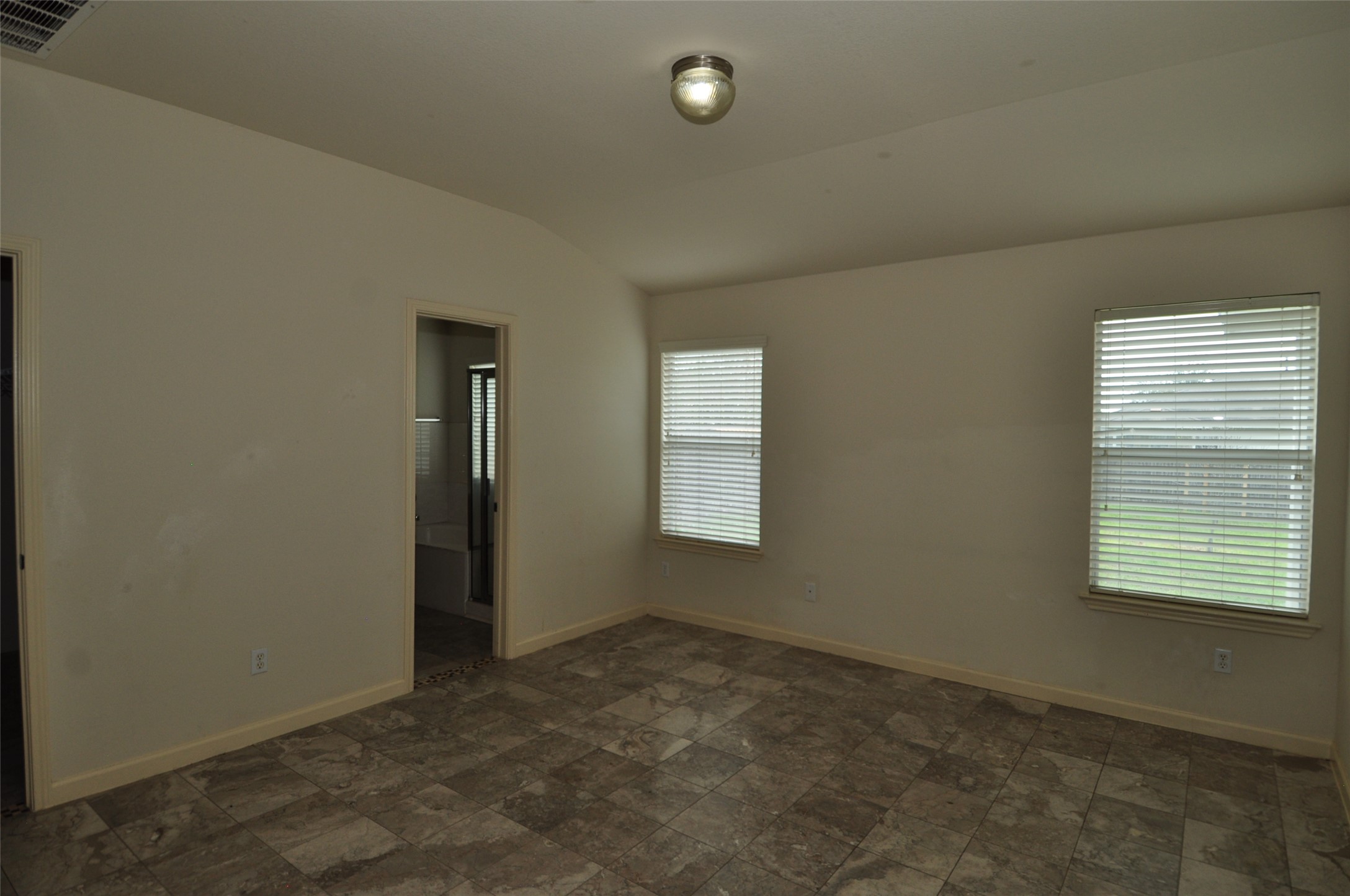 1409 Tea Leaf Drive Pflugerville, TX 78660 - Photo 4 of 18 An inviting room boasts ample natural light from multiple windows and durable tile flooring.