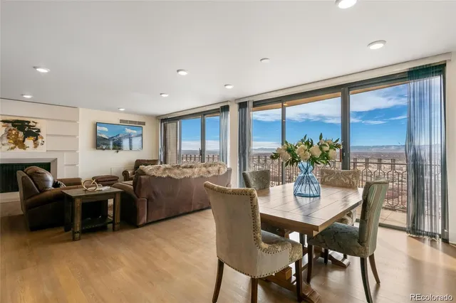 a view of a dining room with furniture window and wooden floor