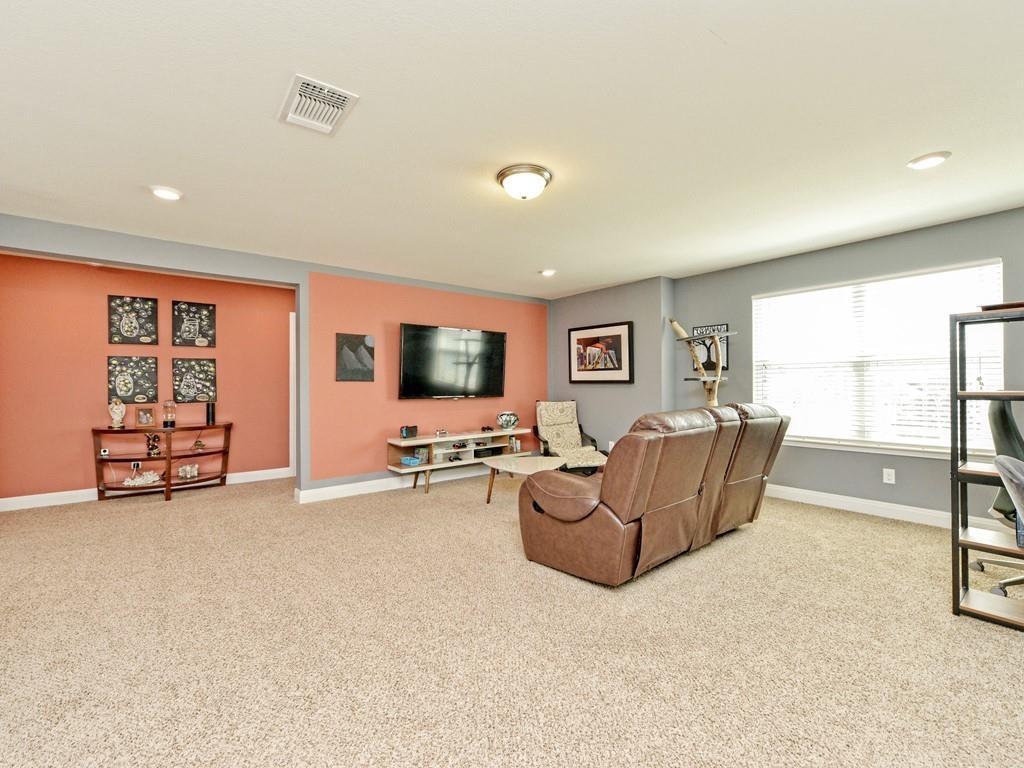 1067 Toltec Trail Georgetown, TX 78626 - Photo 17 of 30 Living room featuring light colored carpet and recessed lighting
