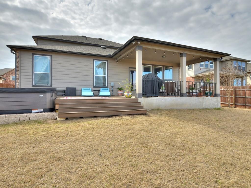 1067 Toltec Trail Georgetown, TX 78626 - Photo 27 of 30 Rear view of house featuring a deck and a patio