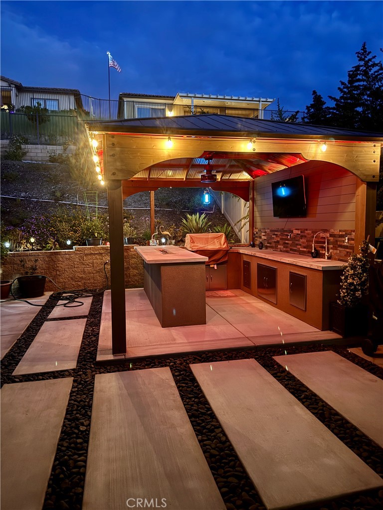 11137 Briar Rose Court Corona, CA 92883 - Photo 42 of 75 a view of a patio with swimming pool