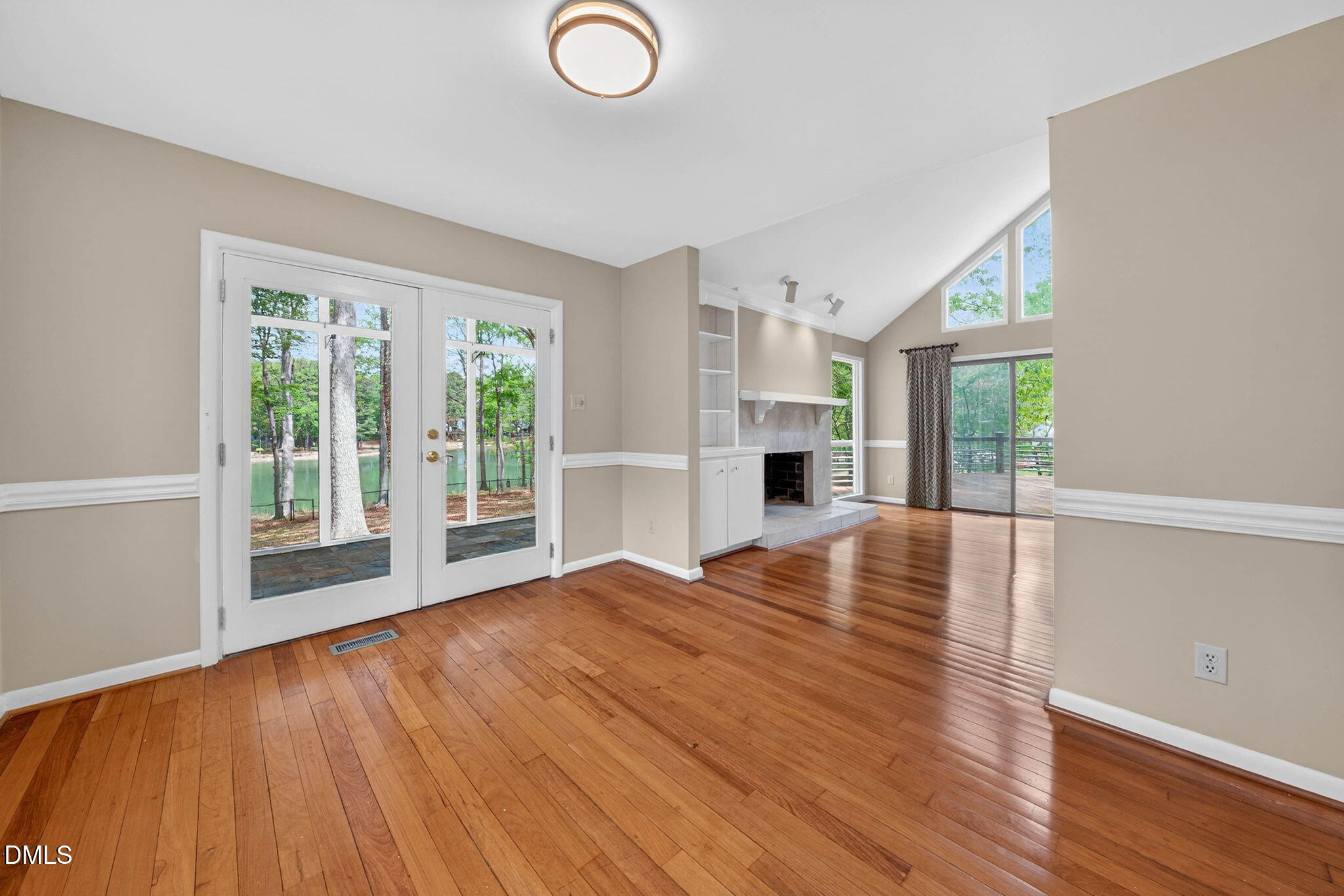 11617 Coachmans Way Raleigh, NC 27614 - Photo 19 of 79 Formal dining room overlooks the screened porch with lake views.