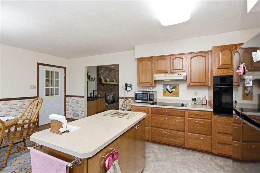 873 Linden Road Eighty Four, PA 15330 - Photo 21 of 40 a kitchen with stainless steel appliances kitchen island granite countertop a sink and cabinets