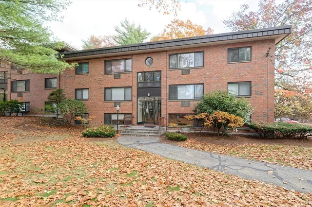 a view of a car park in front of a house