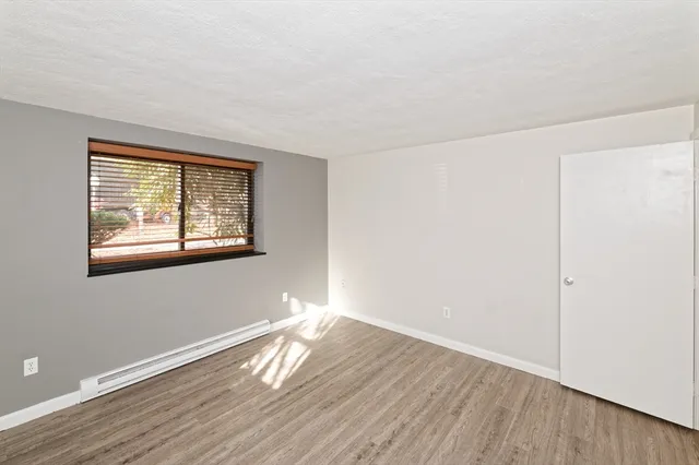 a bathroom with a granite countertop toilet a sink and a bathtub