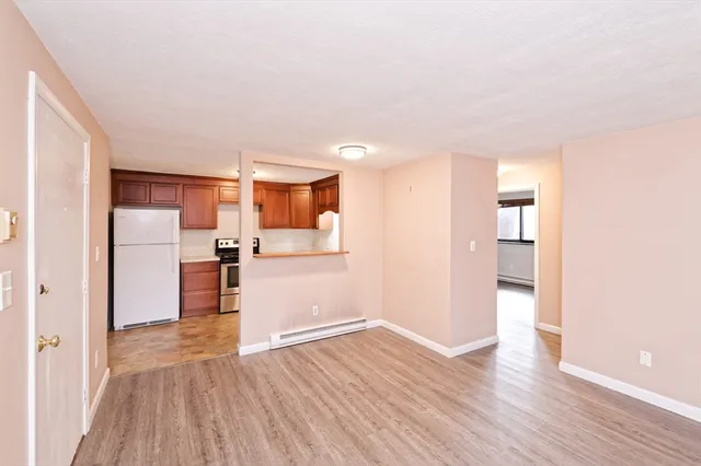 a view of kitchen with wooden floor