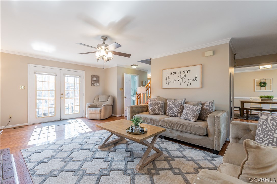 7607 Genuine Risk Lane Midlothian, VA 23112 - Photo 11 of 48 a living room with furniture a dining table and a chandelier