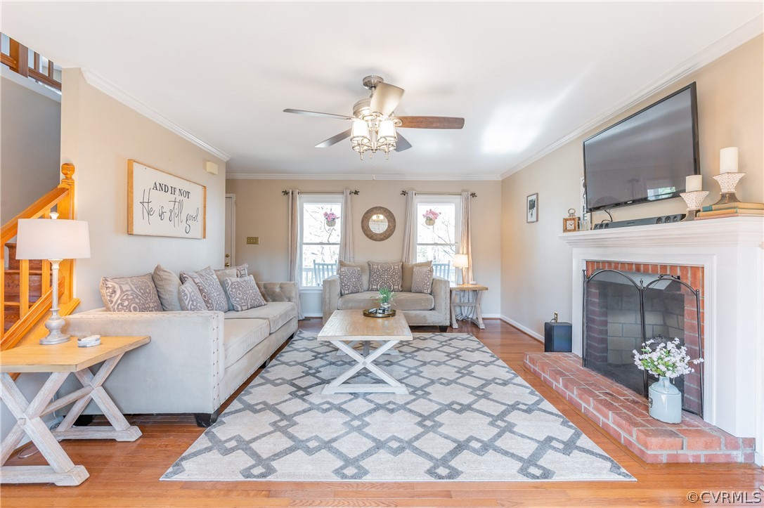 7607 Genuine Risk Lane Midlothian, VA 23112 - Photo 13 of 48 a living room with furniture and a fireplace