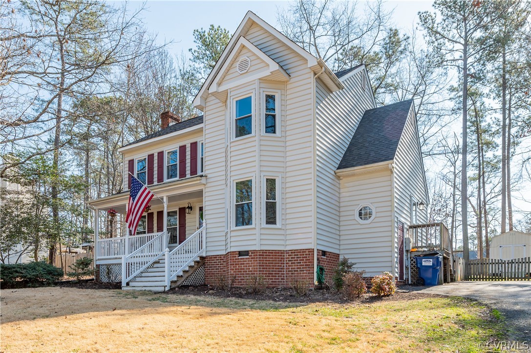 7607 Genuine Risk Lane Midlothian, VA 23112 - Photo 2 of 48 a front view of a house with a yard covered with snow