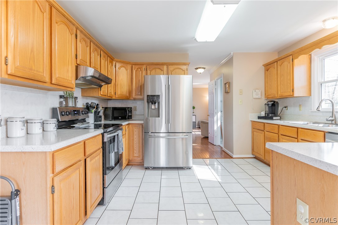 7607 Genuine Risk Lane Midlothian, VA 23112 - Photo 21 of 48 a kitchen with stainless steel appliances granite countertop a refrigerator a stove and a sink