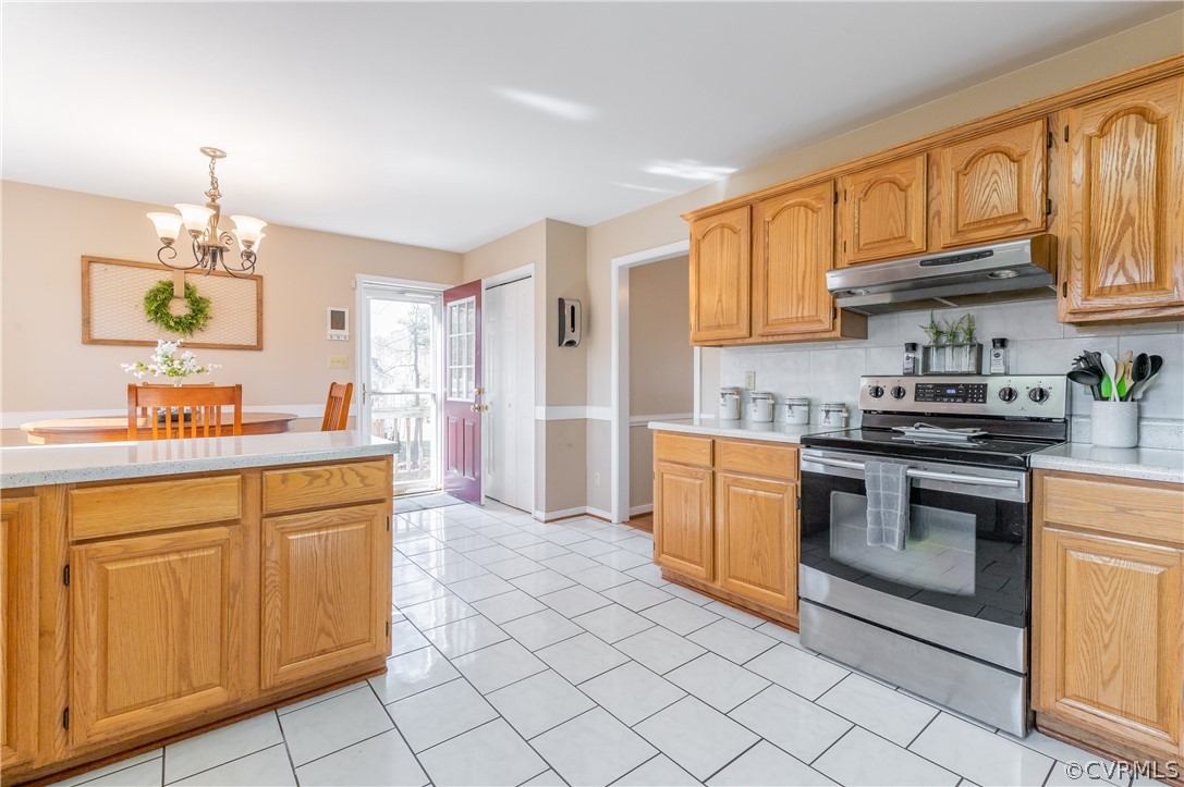 7607 Genuine Risk Lane Midlothian, VA 23112 - Photo 24 of 48 a kitchen with stainless steel appliances granite countertop a sink and cabinets
