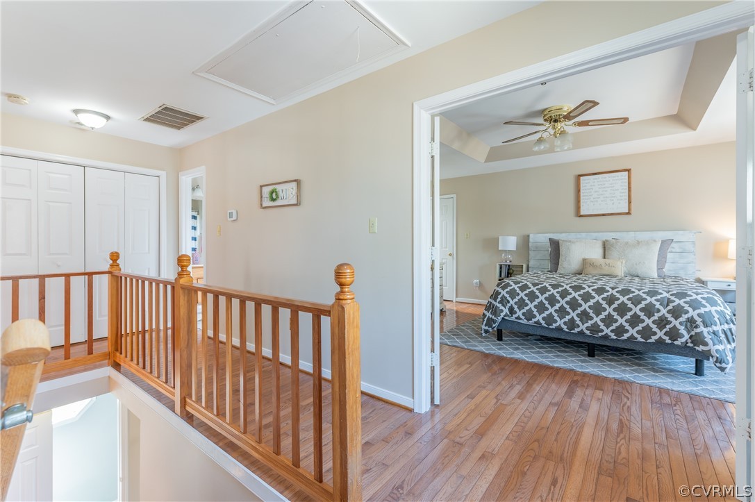 7607 Genuine Risk Lane Midlothian, VA 23112 - Photo 26 of 48 a bedroom with a bed and wooden floor
