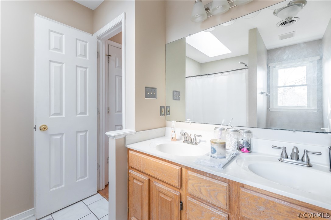 7607 Genuine Risk Lane Midlothian, VA 23112 - Photo 31 of 48 a bathroom with a sink and a mirror
