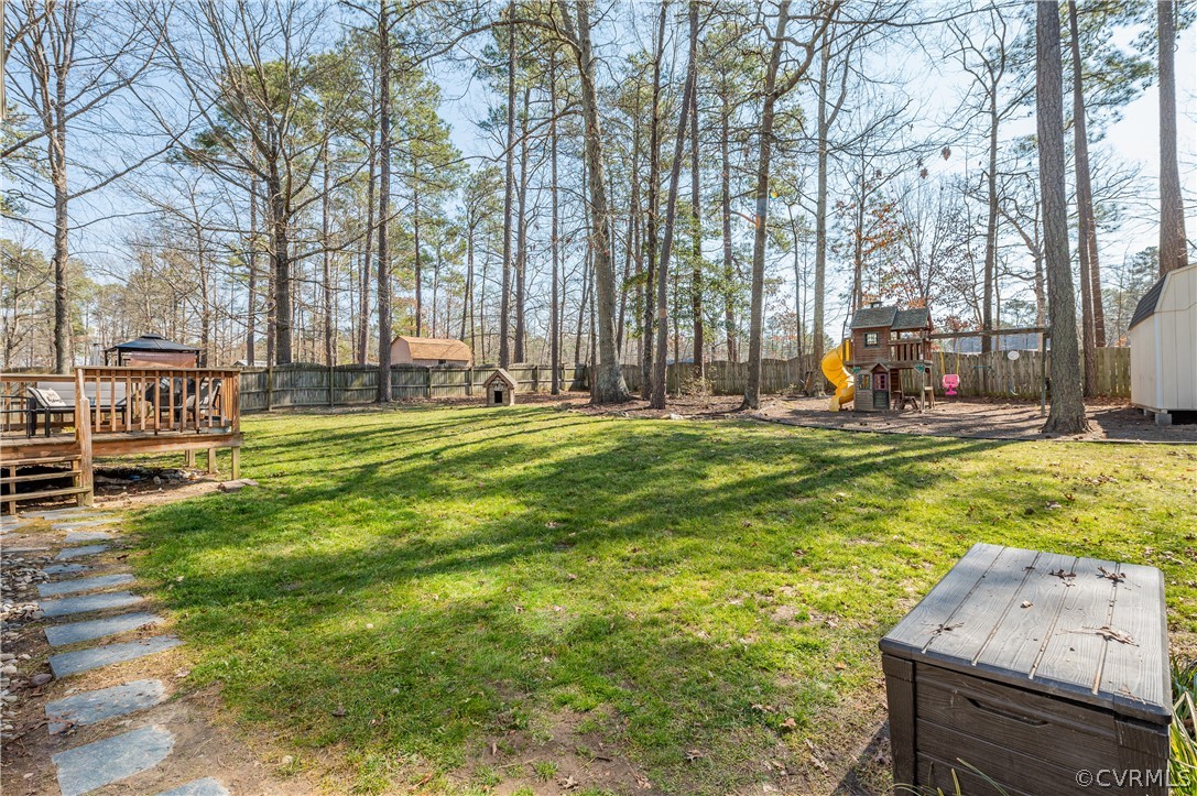 7607 Genuine Risk Lane Midlothian, VA 23112 - Photo 38 of 48 a swimming pool with outdoor seating and yard