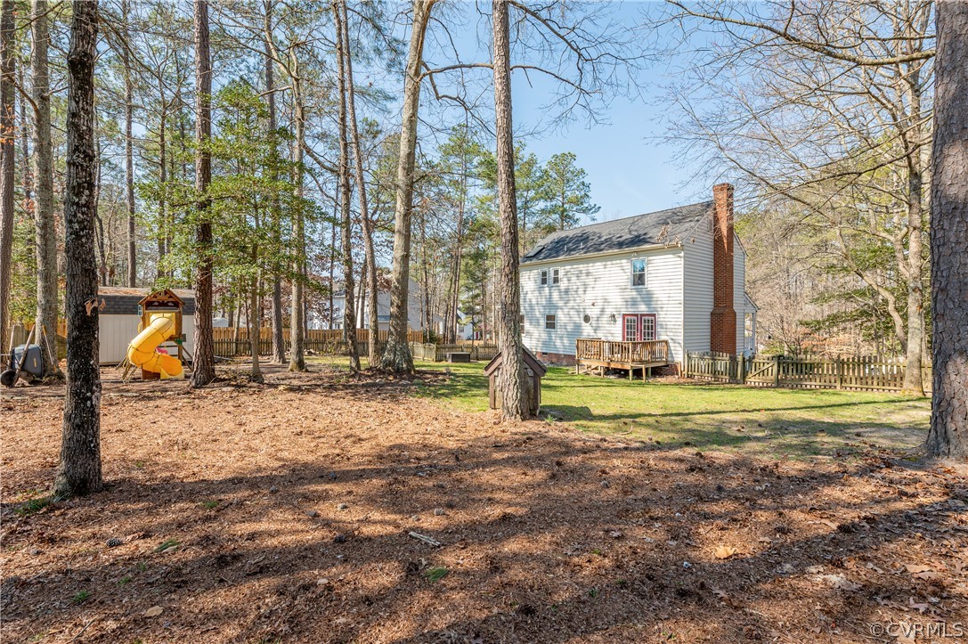 7607 Genuine Risk Lane Midlothian, VA 23112 - Photo 46 of 48 a view of a house with a yard and sitting area