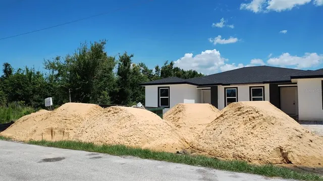a view of house with yard and entertaining space