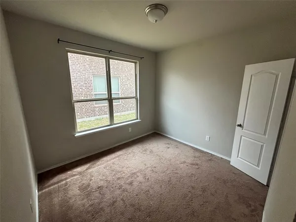a view of a bathroom from a hallway