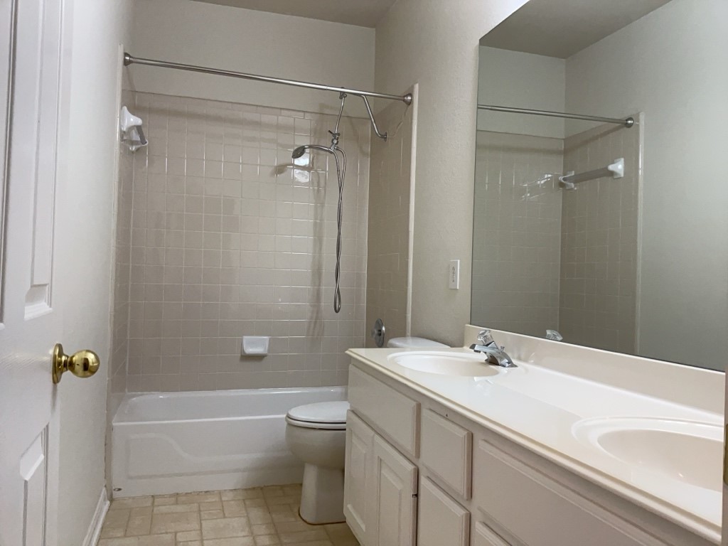 2013 Inverness Drive Round Rock, TX 78681 - Photo 21 of 26 Full bathroom with vanity, and shower/tub combination