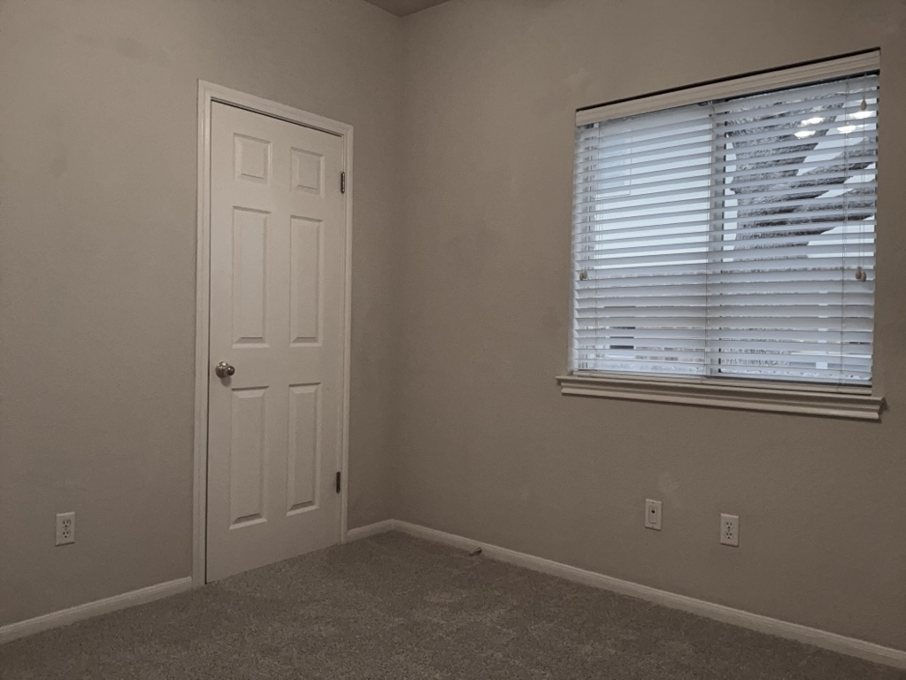 2013 Inverness Drive Round Rock, TX 78681 - Photo 22 of 26 Secondary bedroom with natural light and carpet