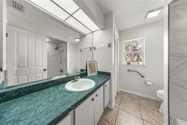 a bathroom with a toilet and a bathtub