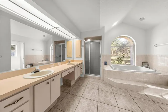 a view of a bathroom with a sink and a shower