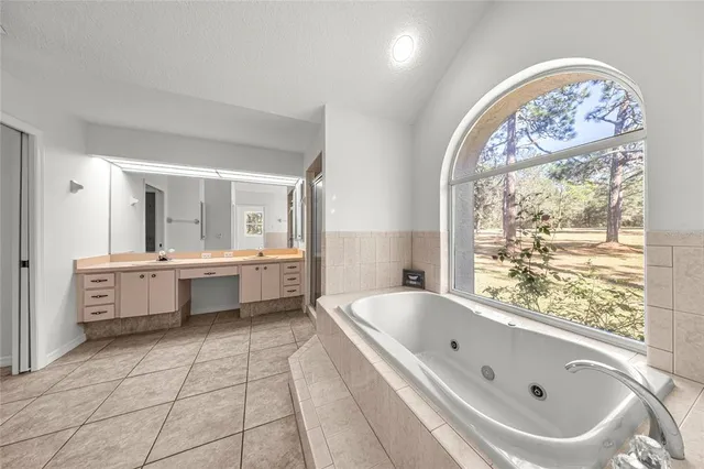 a bathroom with a bathtub and shower