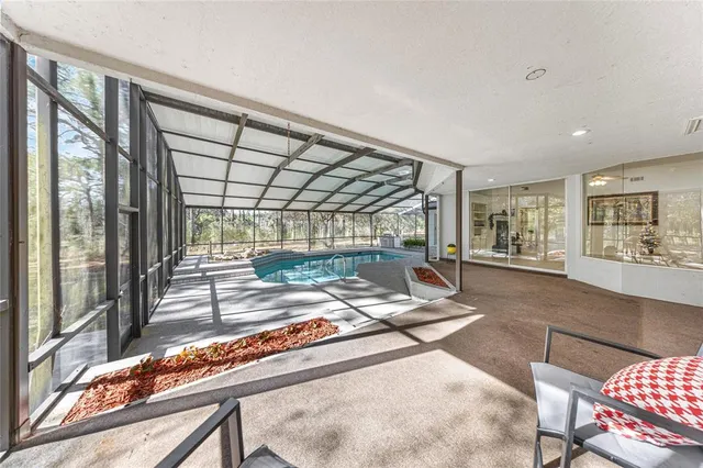 a view of a porch with furniture and wooden floor