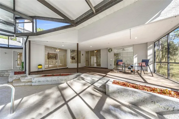 a swimming pool with outdoor seating