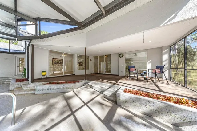 a swimming pool with outdoor seating