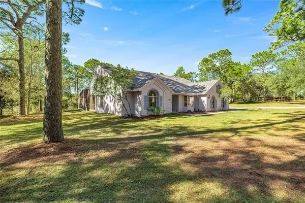 a view of swimming pool with an outdoor space and seating area