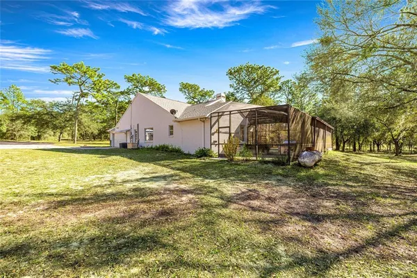 a backyard of a house with lots of green space