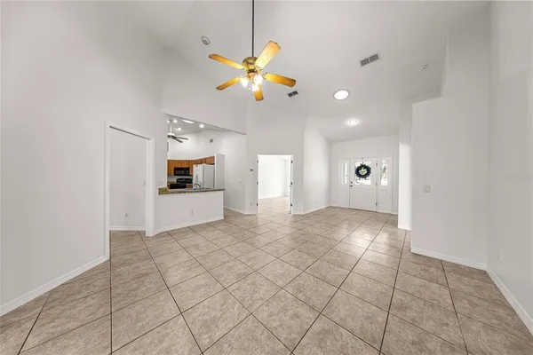 a kitchen with stainless steel appliances granite countertop a sink and a refrigerator