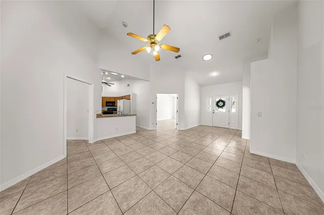 a kitchen with stainless steel appliances granite countertop a sink and a refrigerator