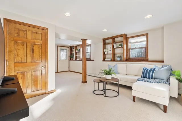 a living room with furniture and a window